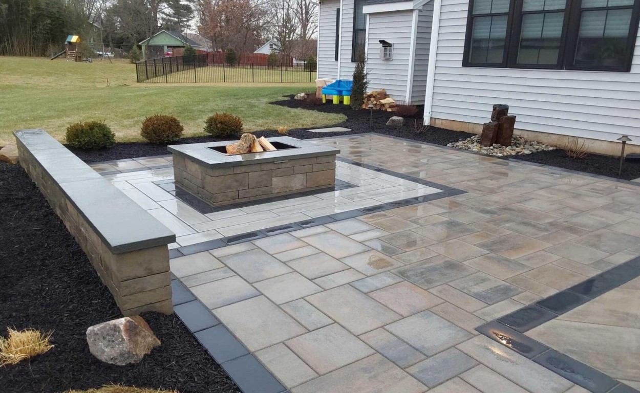 Low-maintenance concrete patio with fire pit in Sayreville, NJ